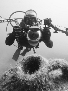 UW photographer v/s ancient amphora ;-) B/W shot with nat... by Rico Besserdich 